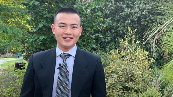 A young student in a suit